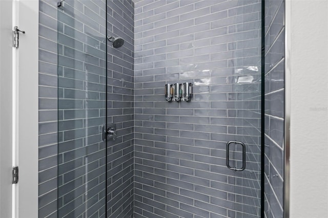 bathroom with a shower stall