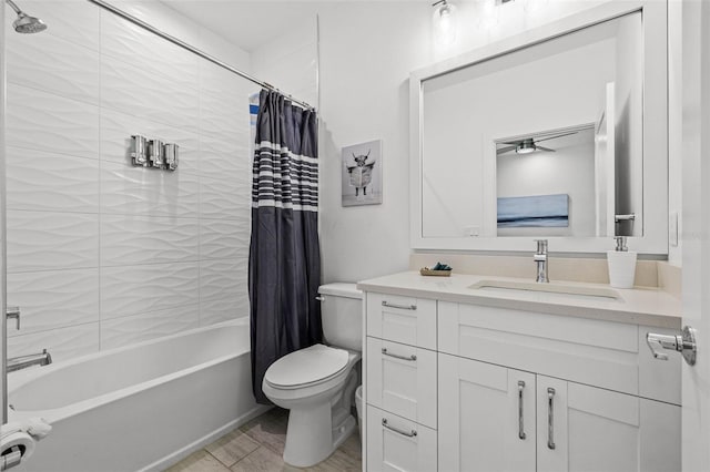 bathroom with vanity, toilet, and shower / bath combo with shower curtain