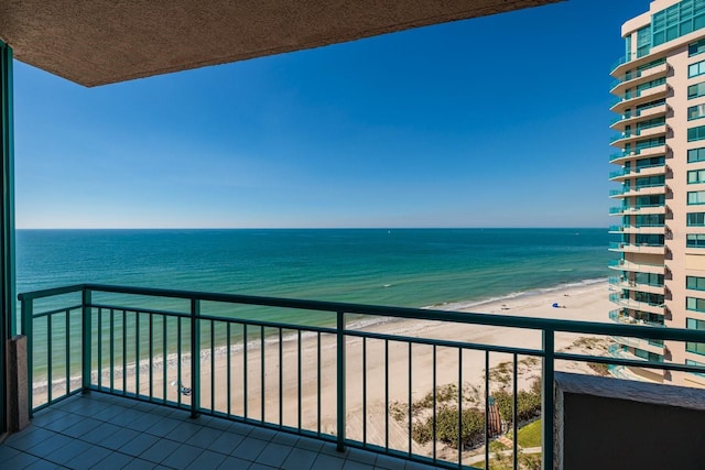 balcony with a view of the beach and a water view