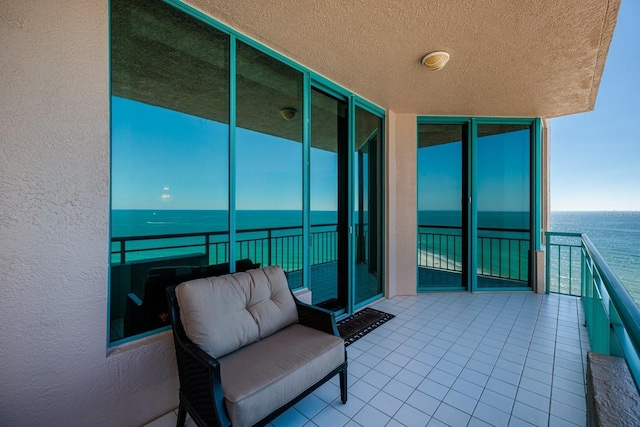 balcony featuring a water view