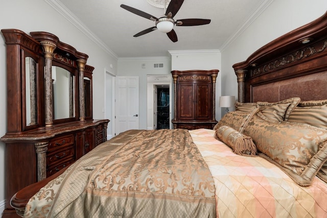 bedroom featuring ornamental molding, visible vents, and ceiling fan