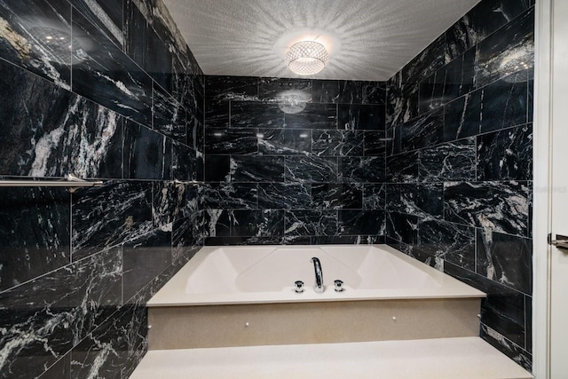 full bathroom featuring a textured ceiling, walk in shower, a bathtub, and tile walls