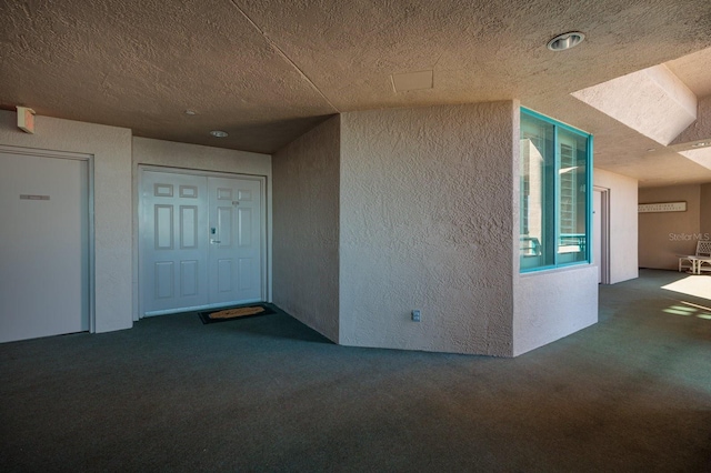 entrance to property featuring stucco siding