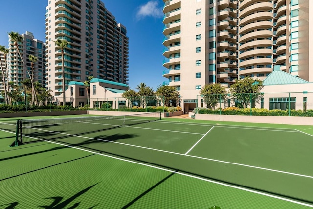 view of sport court with fence