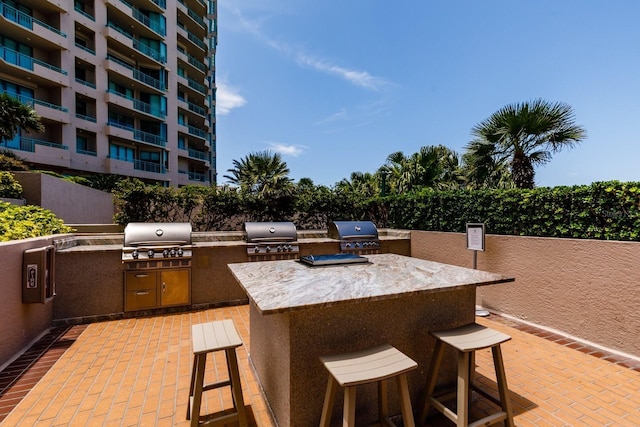 view of patio / terrace featuring an outdoor kitchen and area for grilling