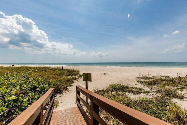 property view of water featuring a beach view