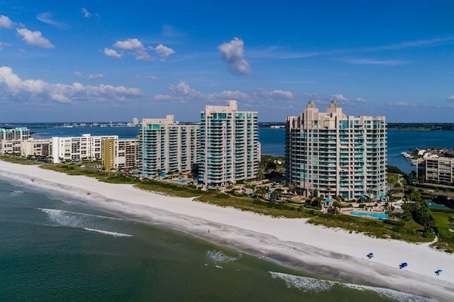 drone / aerial view with a view of city, a beach view, and a water view