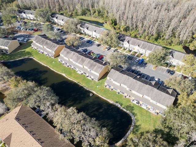 bird's eye view featuring a residential view and a water view