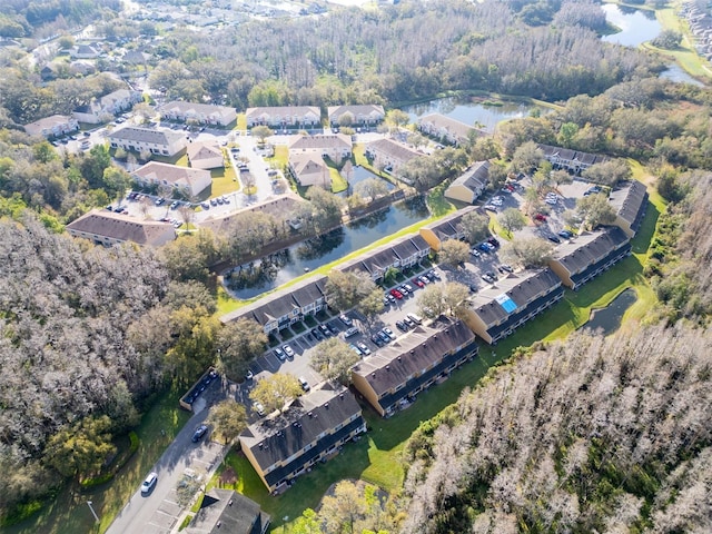 bird's eye view featuring a water view and a residential view