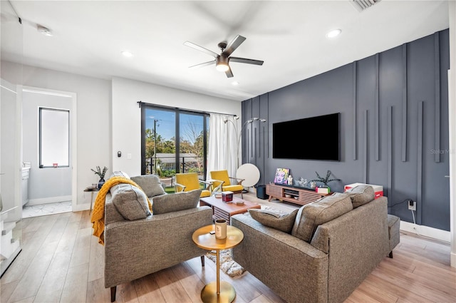 living area featuring recessed lighting, visible vents, ceiling fan, light wood-type flooring, and baseboards