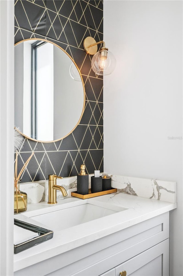 details featuring backsplash and vanity