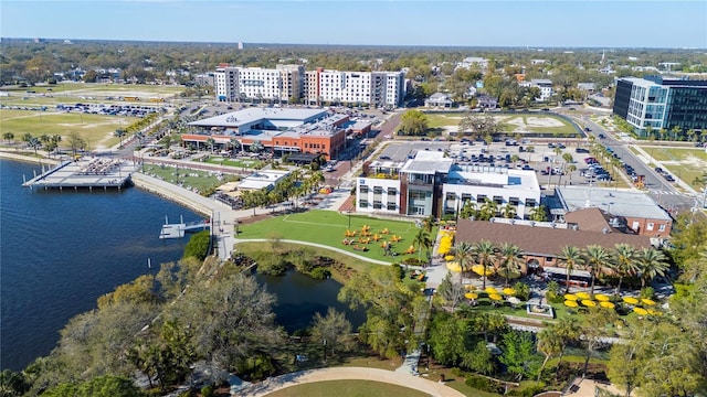 drone / aerial view featuring a water view and a city view