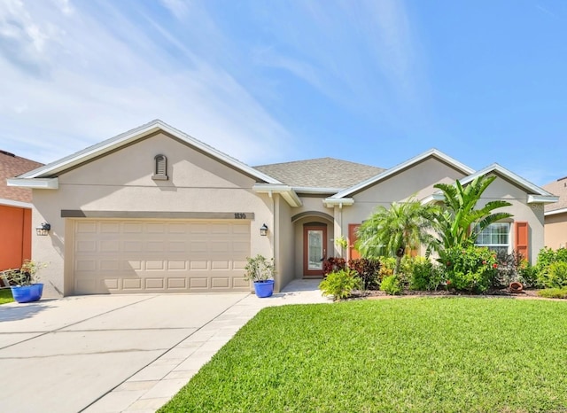 ranch-style house featuring stucco siding, a shingled roof, concrete driveway, an attached garage, and a front lawn