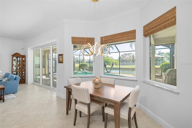 dining room with a notable chandelier, baseboards, light tile patterned floors, and ornamental molding