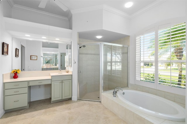 full bathroom featuring vanity, a ceiling fan, ornamental molding, a shower stall, and a garden tub