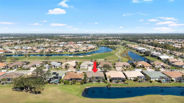 birds eye view of property featuring view of golf course, a residential view, and a water view