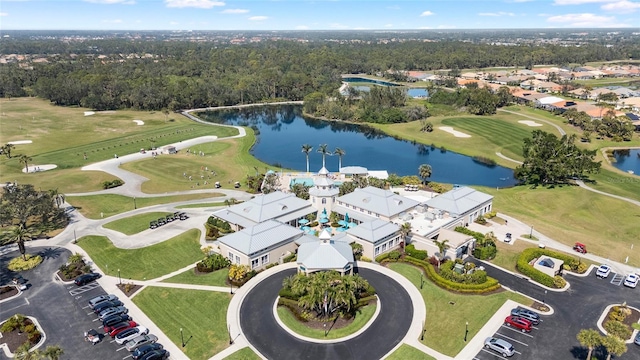 aerial view with a water view, a wooded view, and golf course view