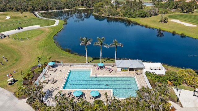 aerial view with a water view and view of golf course