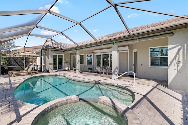 view of swimming pool featuring a patio area, ceiling fan, and a pool with connected hot tub