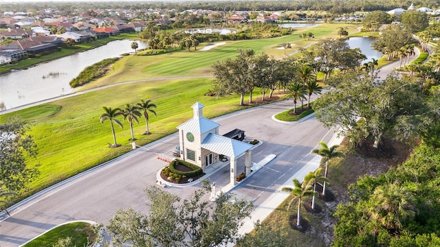 bird's eye view featuring golf course view and a water view