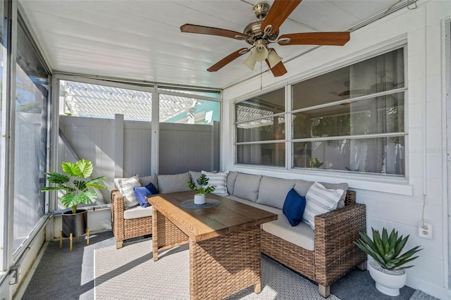 sunroom with a ceiling fan