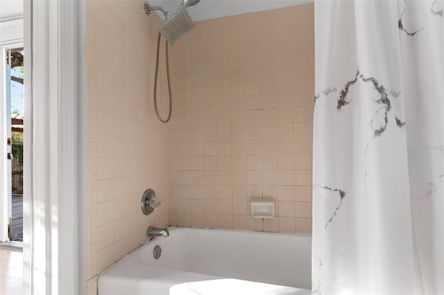 bathroom featuring shower / tub combo with curtain