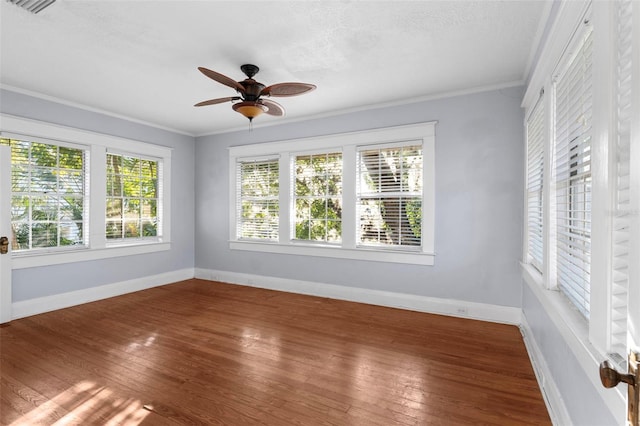 unfurnished sunroom featuring ceiling fan