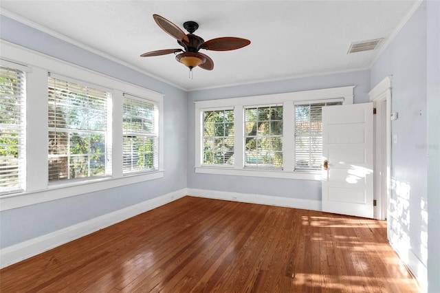 unfurnished sunroom featuring ceiling fan and visible vents