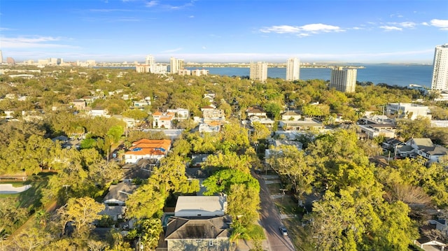 drone / aerial view featuring a water view and a city view