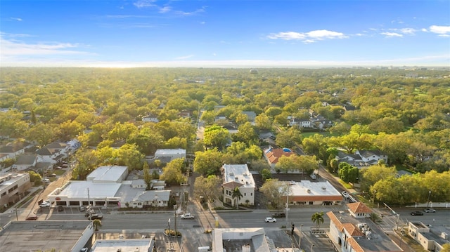 birds eye view of property with a wooded view