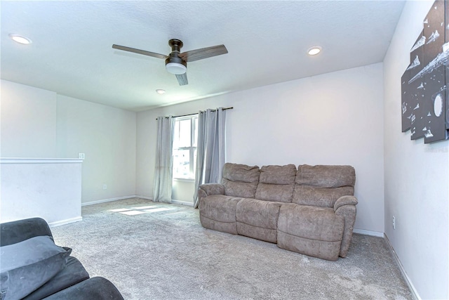 living room with recessed lighting, carpet flooring, a ceiling fan, and baseboards