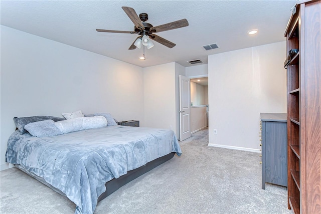 bedroom with visible vents, baseboards, carpet, and ceiling fan