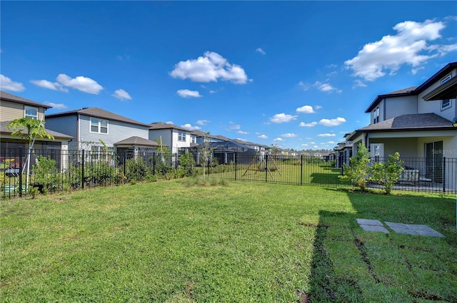 view of yard with a residential view and fence