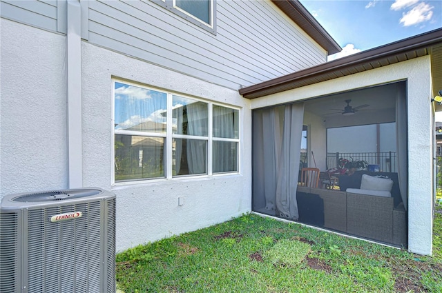 exterior space with cooling unit and a sunroom