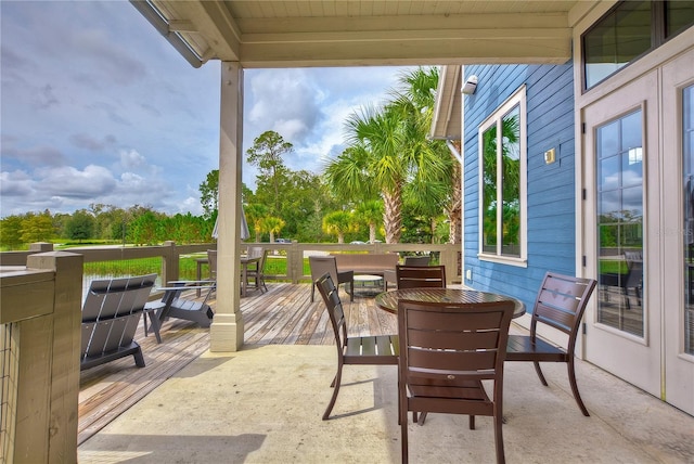 view of patio / terrace featuring outdoor dining area and a deck