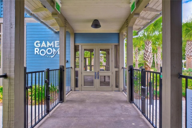 view of exterior entry featuring french doors