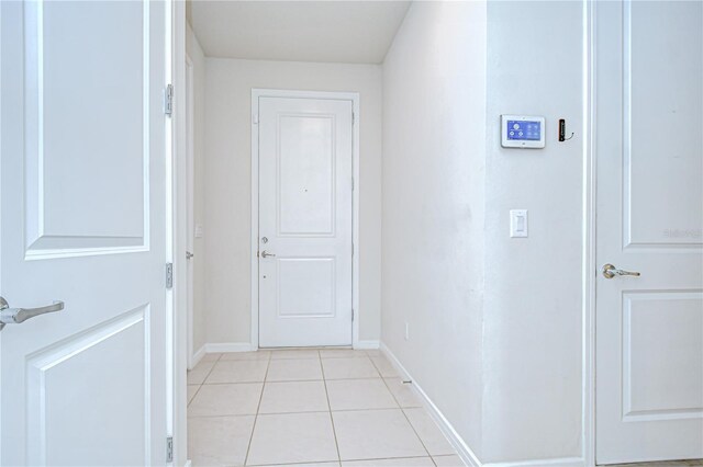 17805 Everlong Dr, Land O Lakes, FL 34638 - hall with baseboards and light tile patterned floors