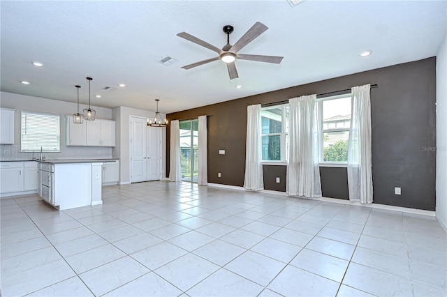 17805 Everlong Dr, Land O Lakes, FL 34638 - unfurnished living room with ceiling fan, healthy amount of natural light, light tile patterned floors, and recessed lighting