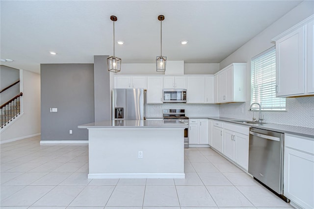 17805 Everlong Dr, Land O Lakes, FL 34638 - kitchen featuring appliances with stainless steel finishes, tasteful backsplash, white cabinetry, and recessed lighting