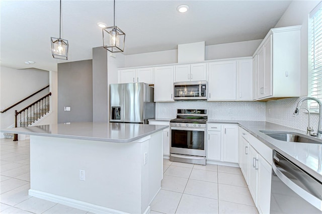17805 Everlong Dr, Land O Lakes, FL 34638 - kitchen featuring stainless steel appliances, light tile patterned flooring, tasteful backsplash, and recessed lighting