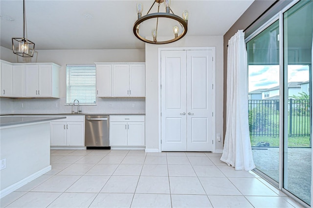 17805 Everlong Dr, Land O Lakes, FL 34638 - kitchen featuring stainless steel dishwasher, a chandelier, light countertops, tasteful backsplash, and white cabinets