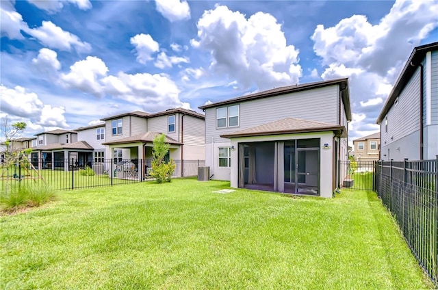 17805 Everlong Dr, Land O Lakes, FL 34638 - back of house with a sunroom, a residential view, a fenced backyard, and roof with shingles