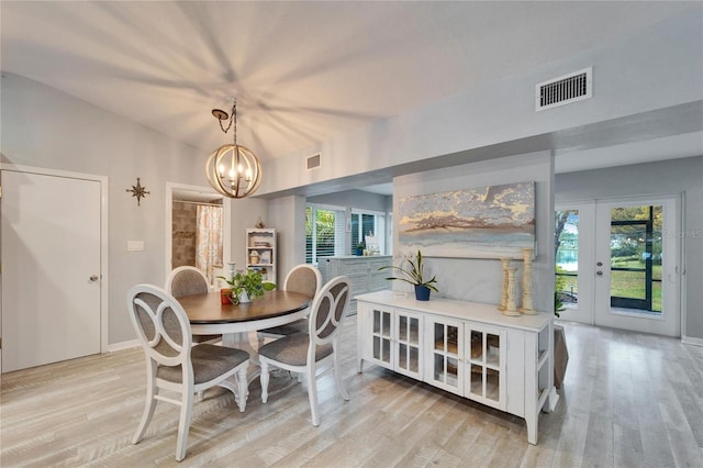 dining area featuring a wealth of natural light, visible vents, and light wood-style flooring