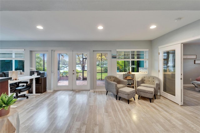 interior space featuring recessed lighting, french doors, baseboards, and wood finished floors