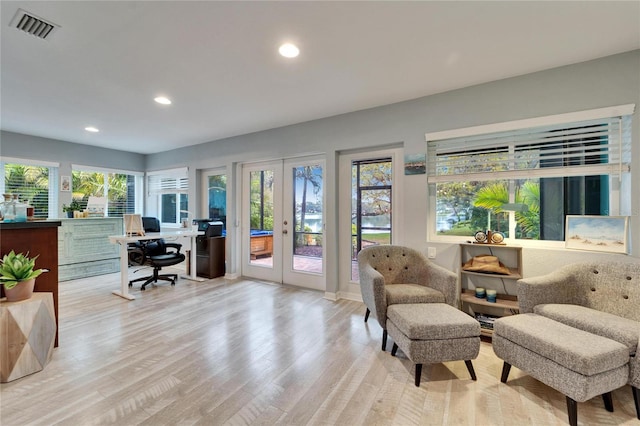 office space with recessed lighting, french doors, visible vents, and light wood finished floors