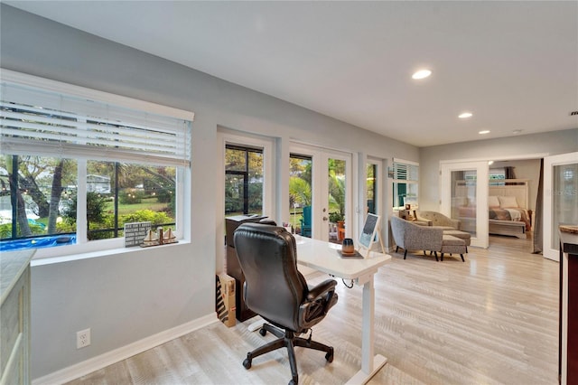 office space with recessed lighting, french doors, baseboards, and light wood-style floors