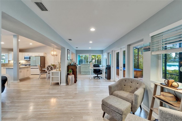 office with visible vents, plenty of natural light, and light wood-style floors