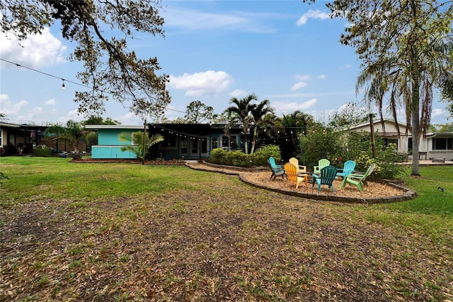 view of yard featuring a fire pit