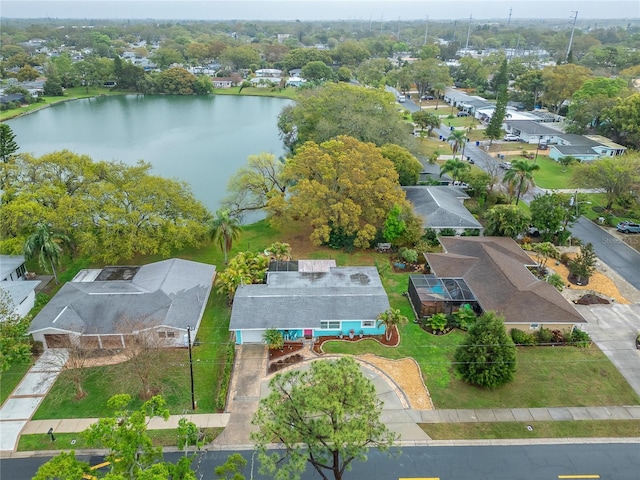 birds eye view of property with a residential view and a water view