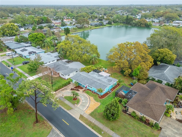 birds eye view of property with a residential view and a water view